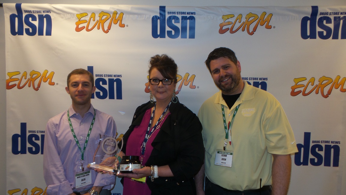 New Product Award winner Topganic EVP Elizabeth DeMaria, center, with DSN's Alex Tomas (left) and ECRM's Josh Clyne