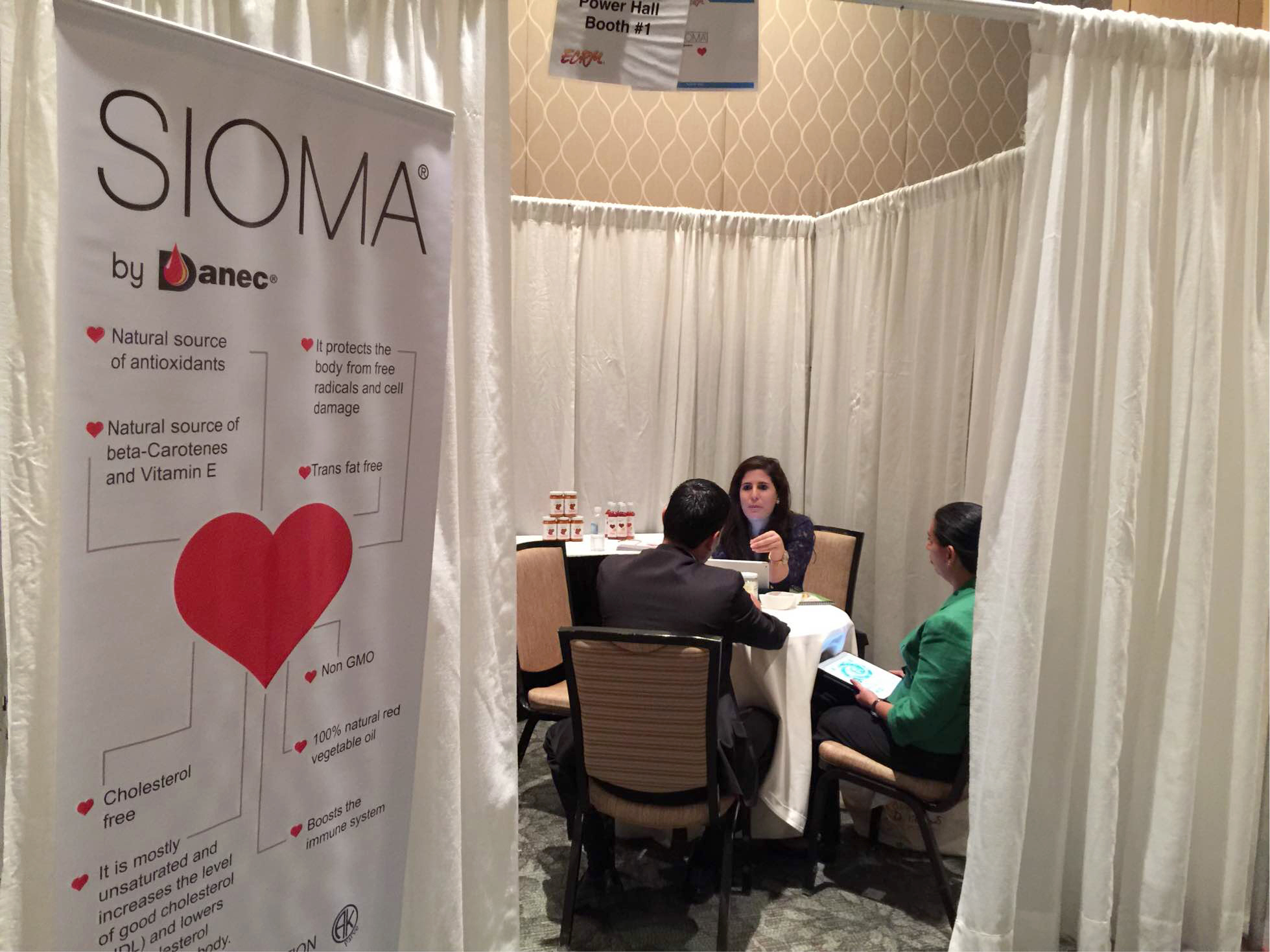 Alejandra Ponce of Danec hard at work meeting with retail event attendees.