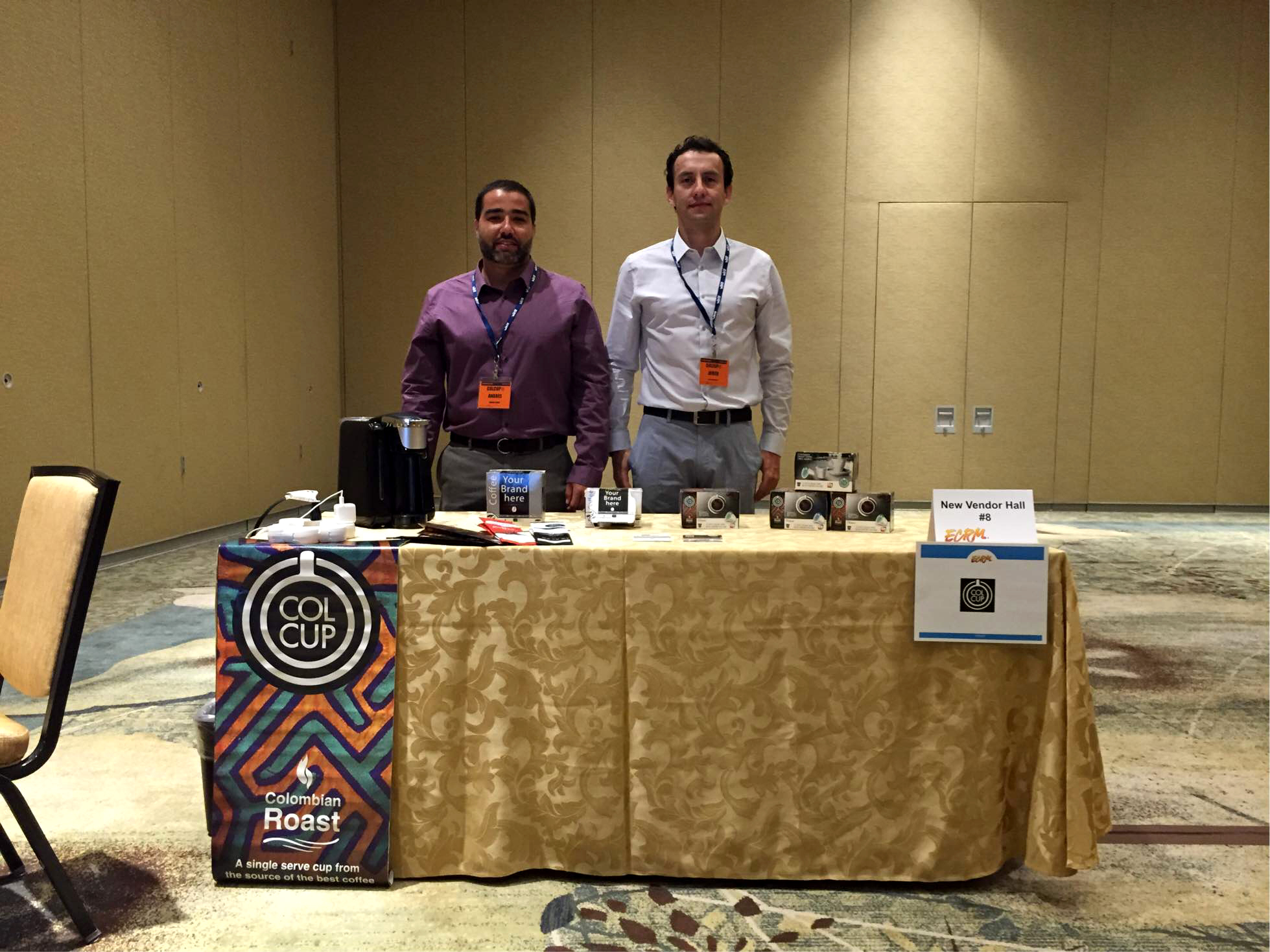 Andres Uribe and Javier Valderrama of Colcup display their single serve cups of 100% Colombian Coffee.